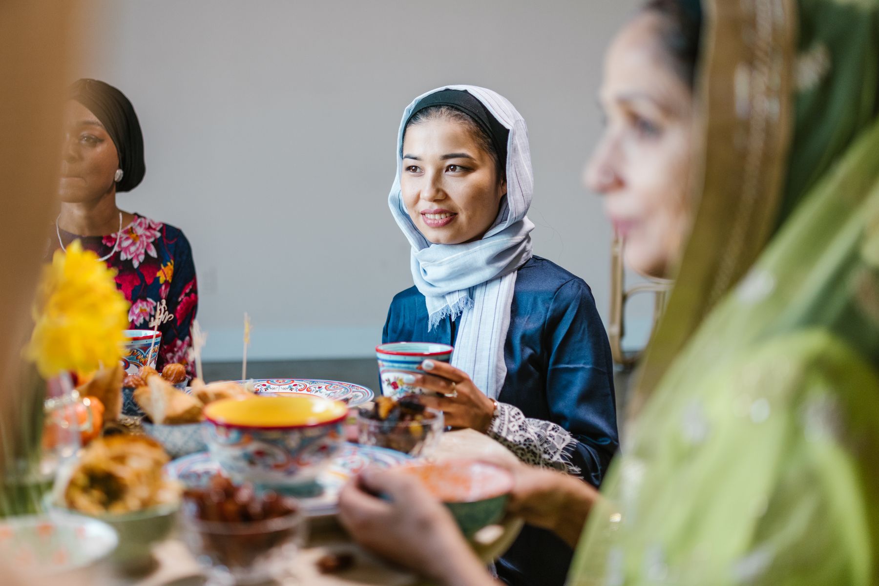Women sharing a Ramadan meal; illustrative stock photography, not a Mahwah Muslims event